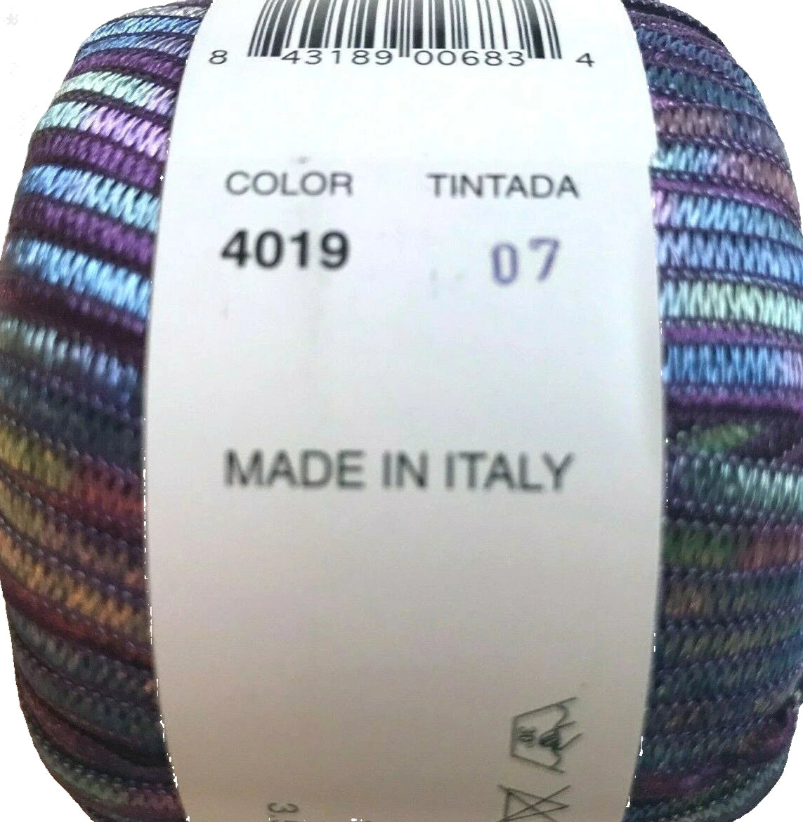 Multicolored yarn ball with a label indicating 'Made in Italy'.
