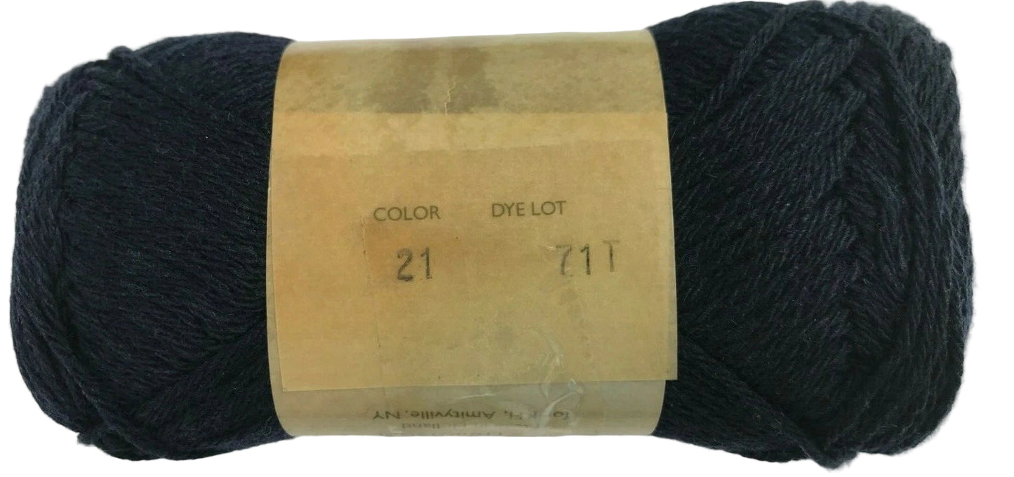 Ball of dark yarn with a label on a white background