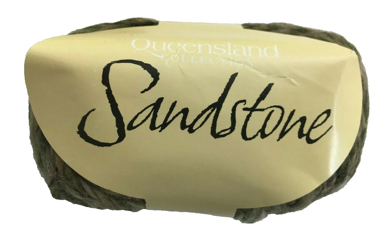 Block of sandstone with 'Queensland Sandstone' branding on a white background