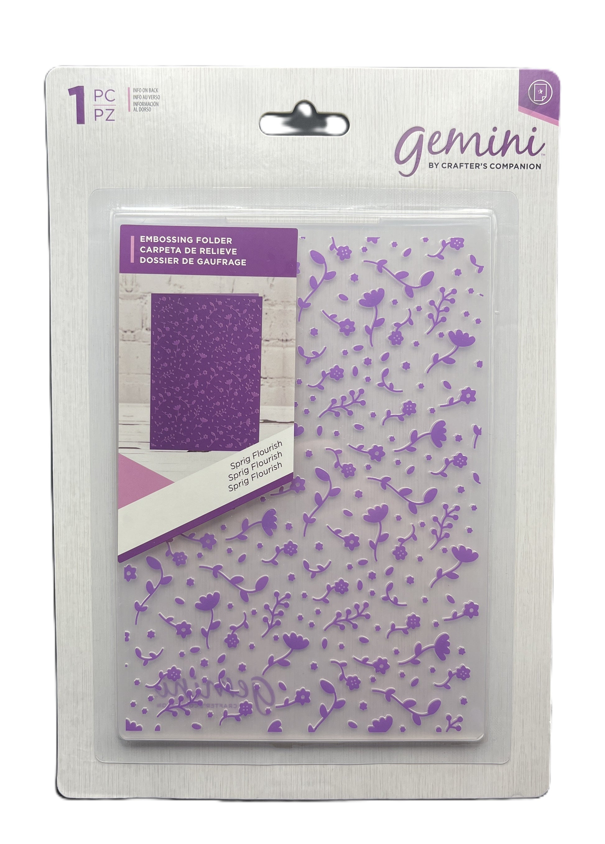 Packaging of Gemini embossing folder with purple floral design on a white background