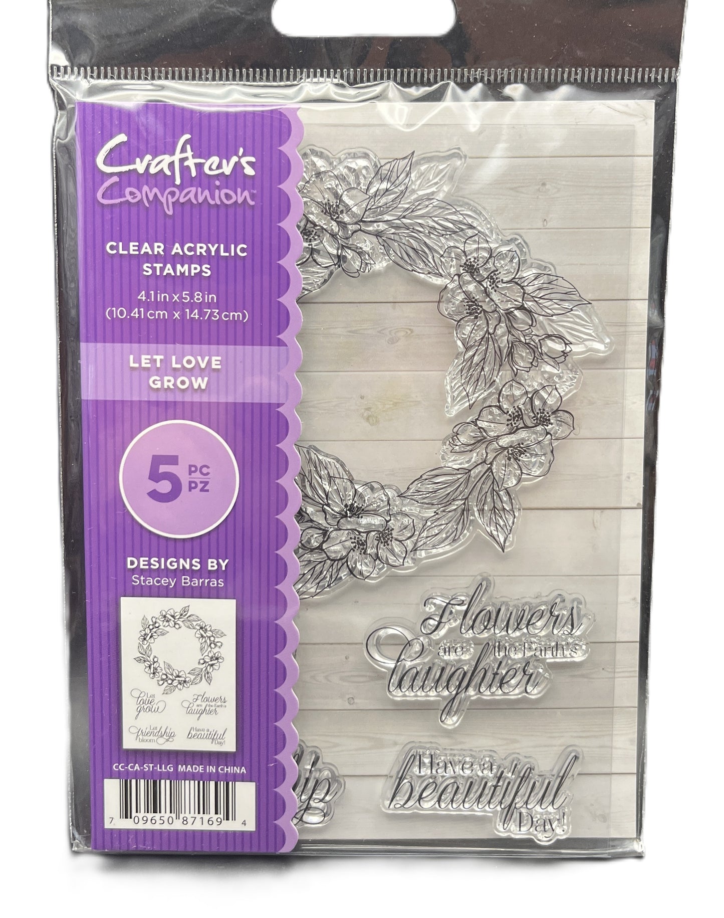 Clear acrylic stamps with floral design and text in packaging