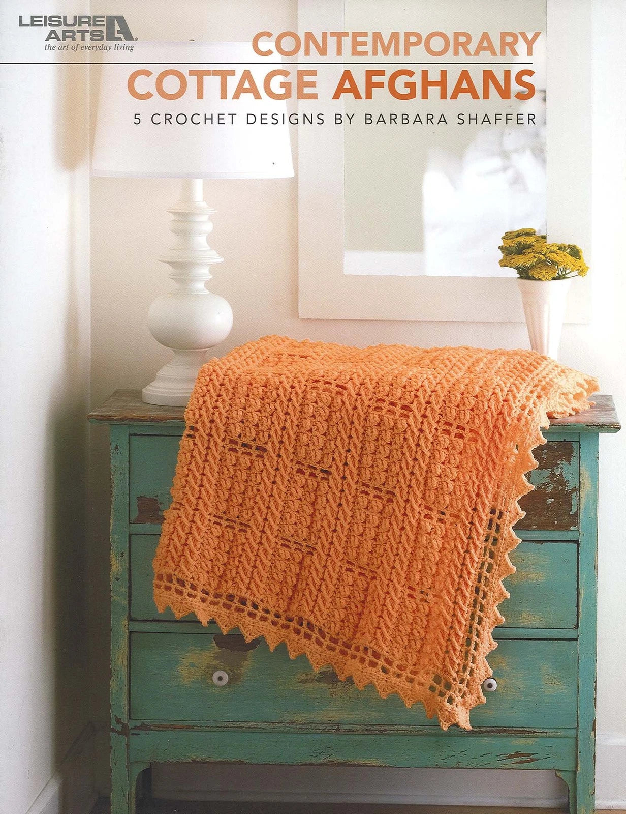 Book cover of 'Contemporary Cottage Afghans' by Barbara Shaffer with an orange crochet afghan on a green cabinet.