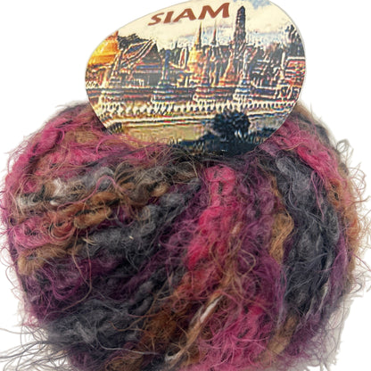 Multicolored yarn ball with a 'SIAM' label on a white background