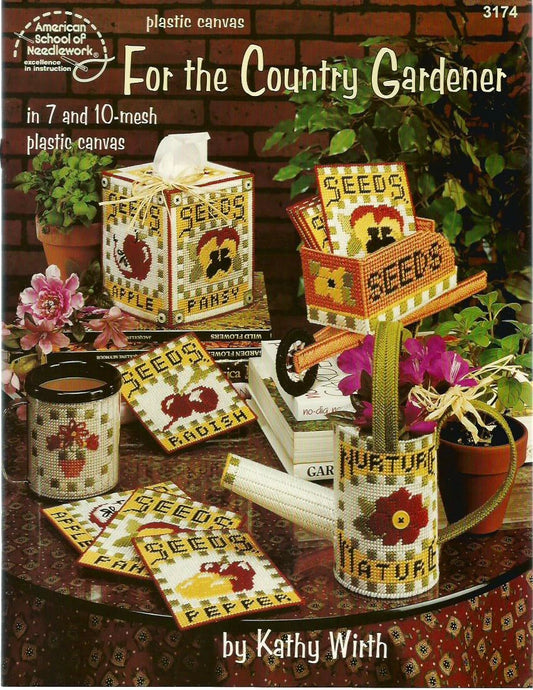 Plastic canvas patterns for garden-themed items including a seed box, watering can, and coasters on a table with plants and flowers.