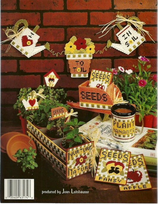 Decorative seedling pots and related items against a brick wall background