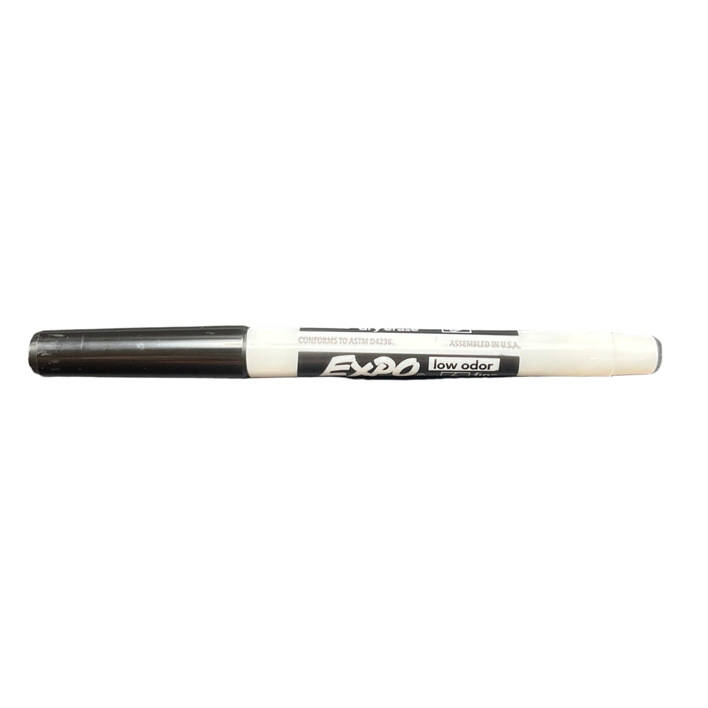 Black marker with white cap on a white background