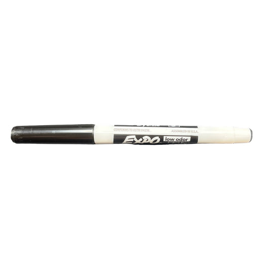 Black marker with white cap on a white background