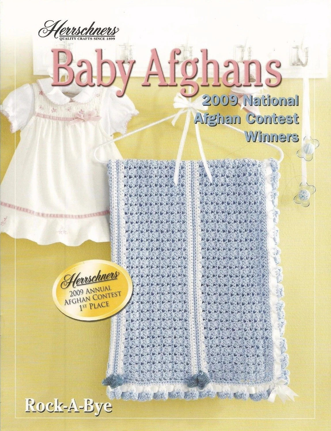 Book cover of 'Baby Afghans' featuring a baby dress and blanket with text about a contest.