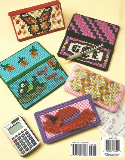 Collection of cross-stitched pouches with various designs on a yellow background, alongside a calculator.