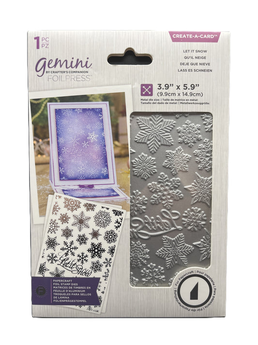Packaging of Gemini foil press with snowflake designs and card on a white background
