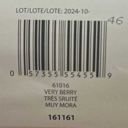 Close-up of a product label with text and barcodes on a textured surface.