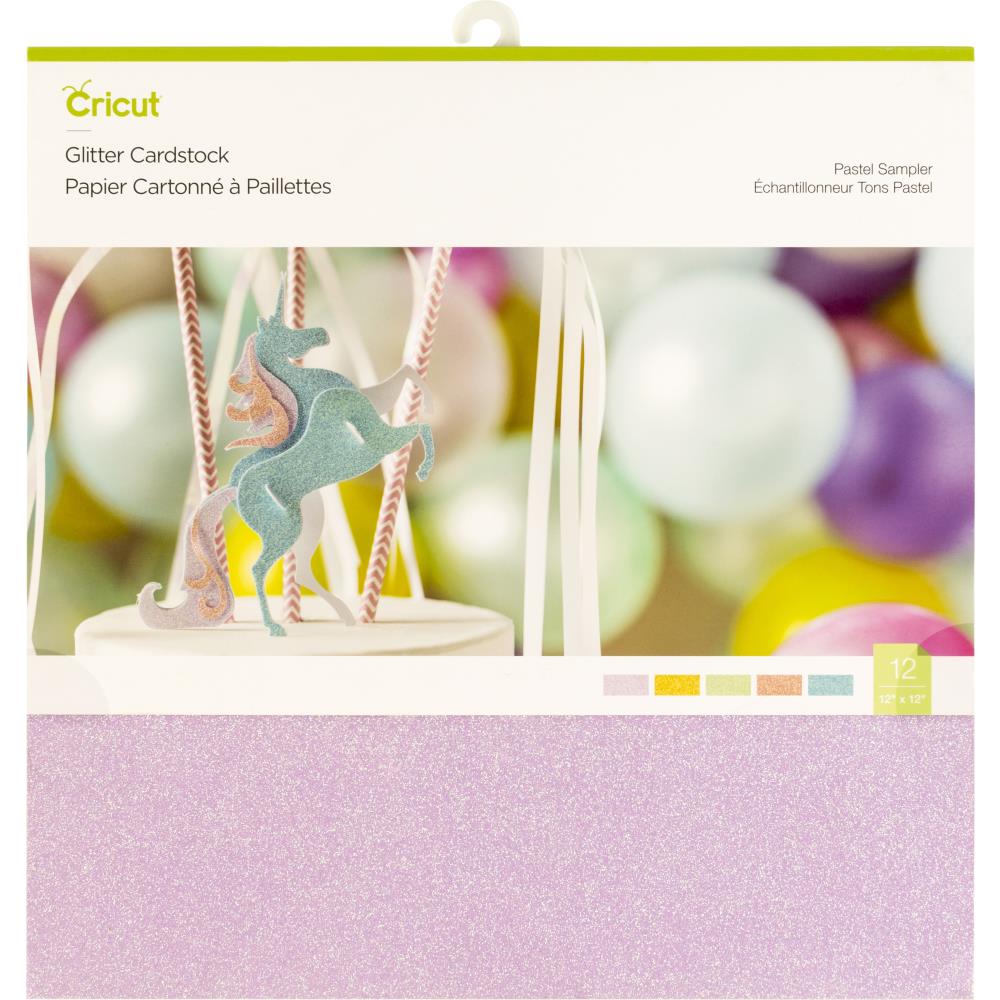 Cricut glitter cardstock with a unicorn design and color swatch on a blurred background