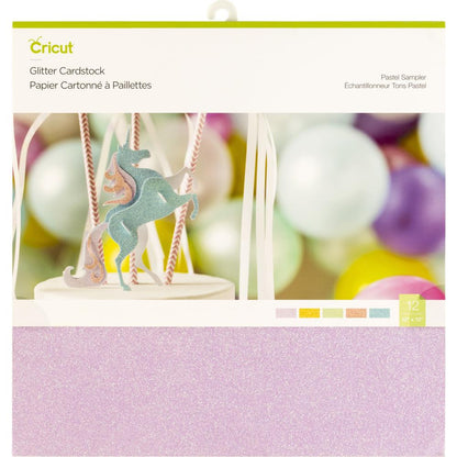 Cricut glitter cardstock with a unicorn design and color swatch on a blurred background