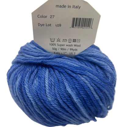 Blue skein of yarn with a label indicating 'made in Italy' on a white background