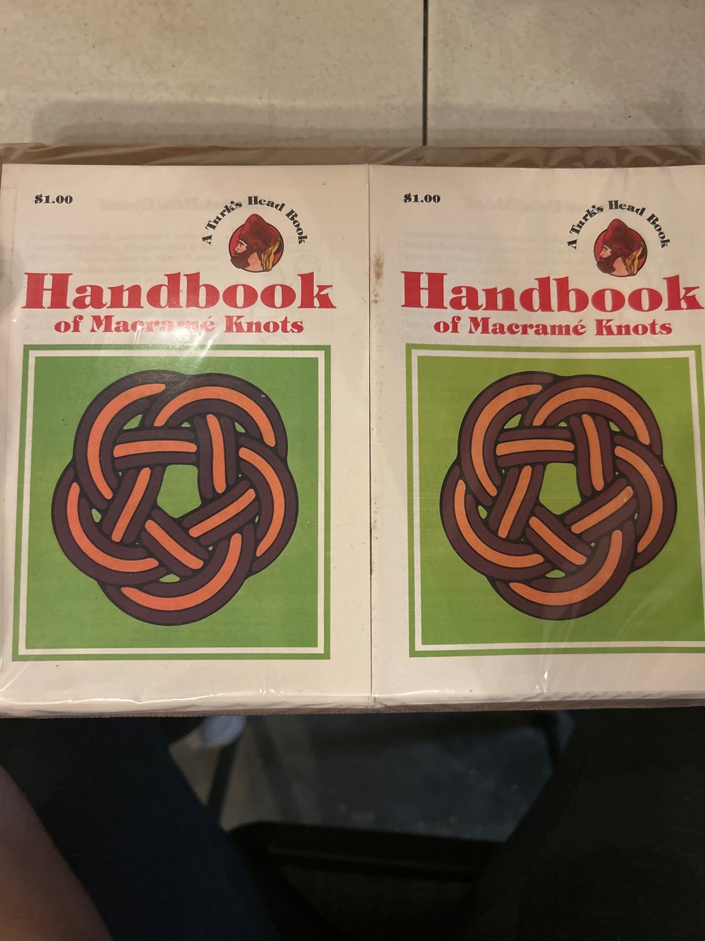 a green square ontop of a white background with an image of an intricate knot in the center of the green square. Book titled "Handbook of Macrame Knots" brand name "A Turk's Head Book"
