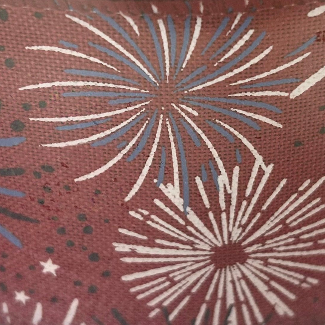 Pattern of starburst shapes on a red background