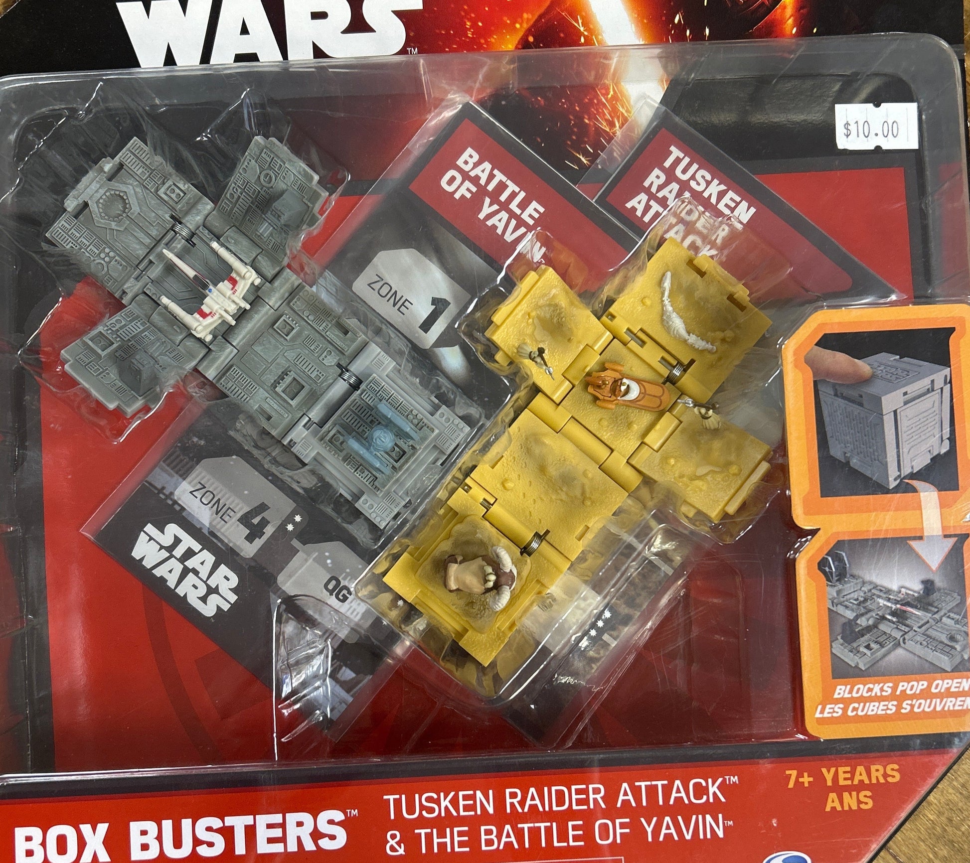 Star Wars toy set in packaging with Tusken Raider and Battle of Yavin elements.