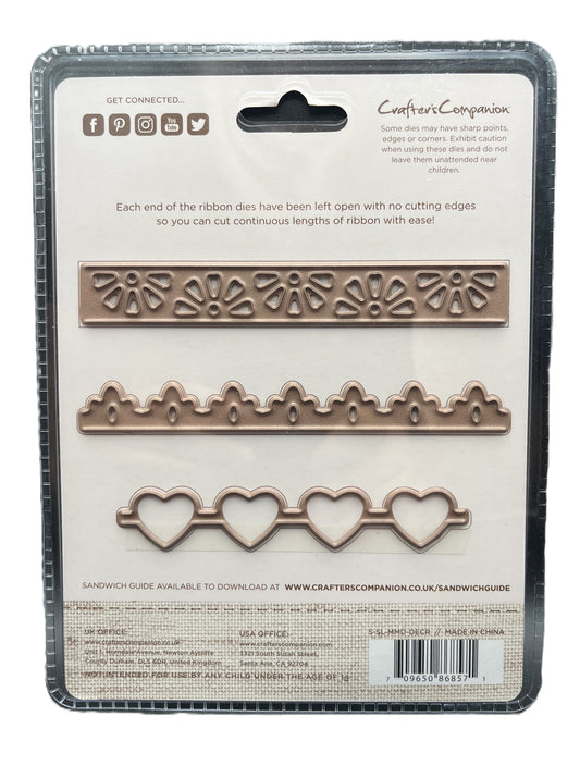 Packaging of Crafters Companion ribbon dies with decorative patterns on a white background.
