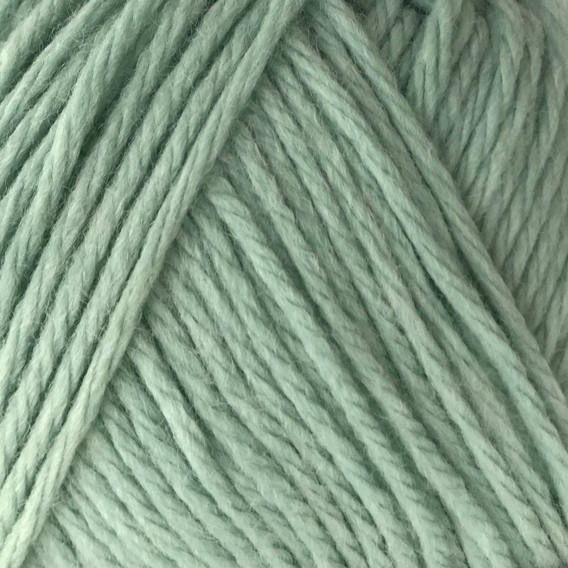 Close-up of light green yarn strands