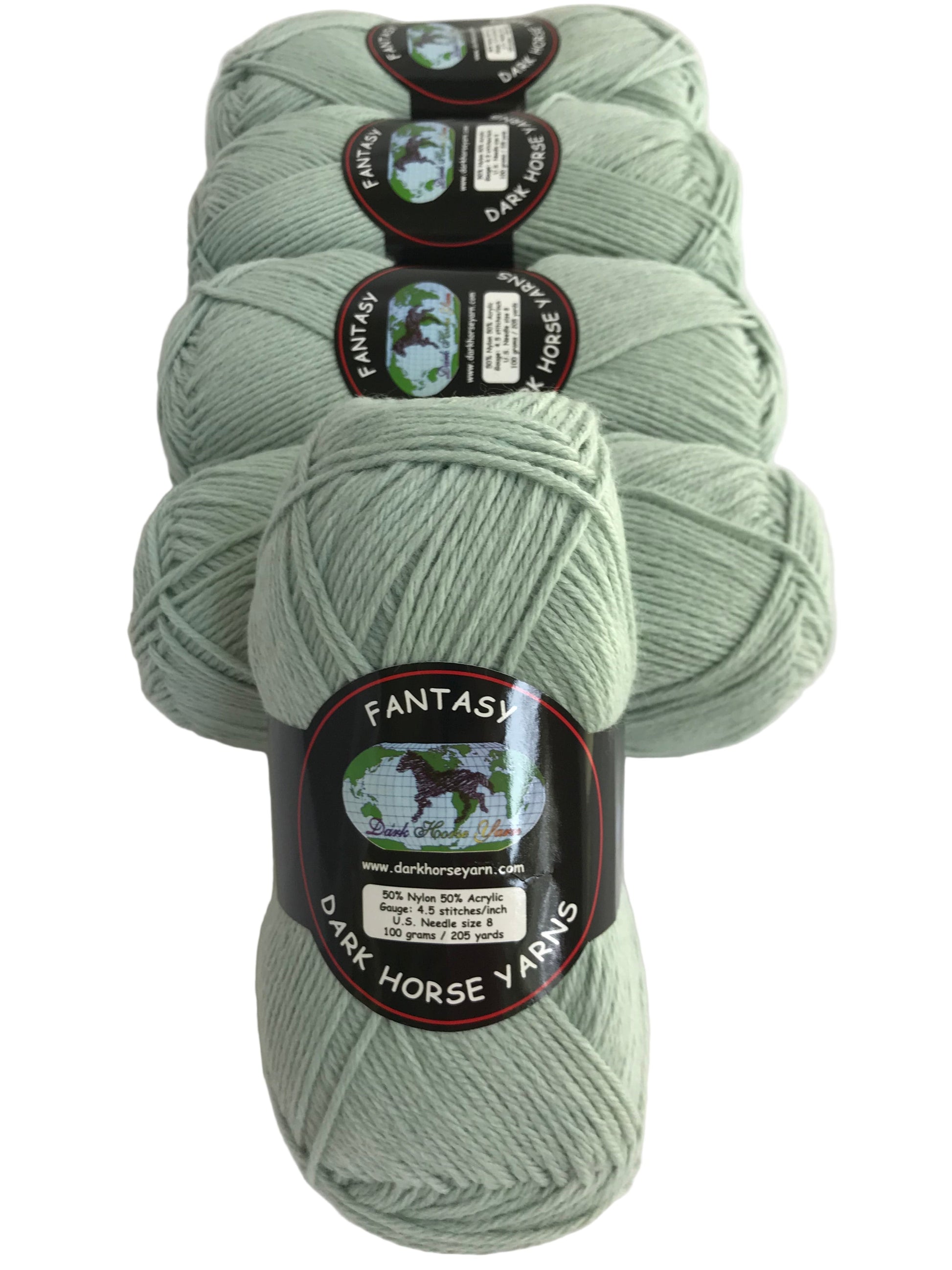 Four skeins of light green yarn with 'Fantasy' labels on a white background