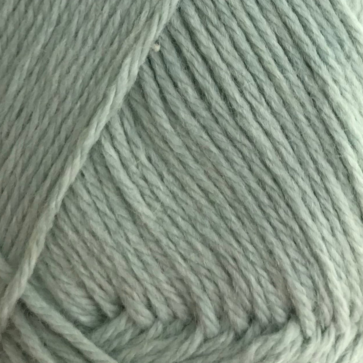 Close-up of a ball of light green yarn