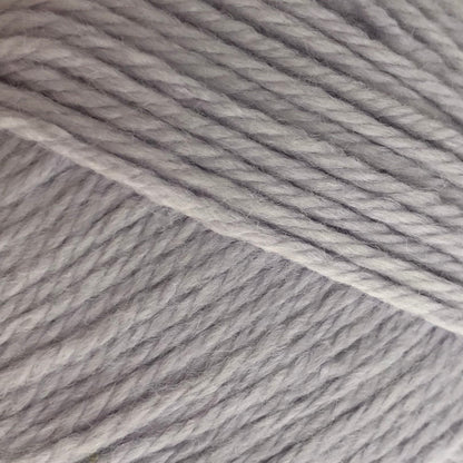 Gray skein of yarn with a label on a white background