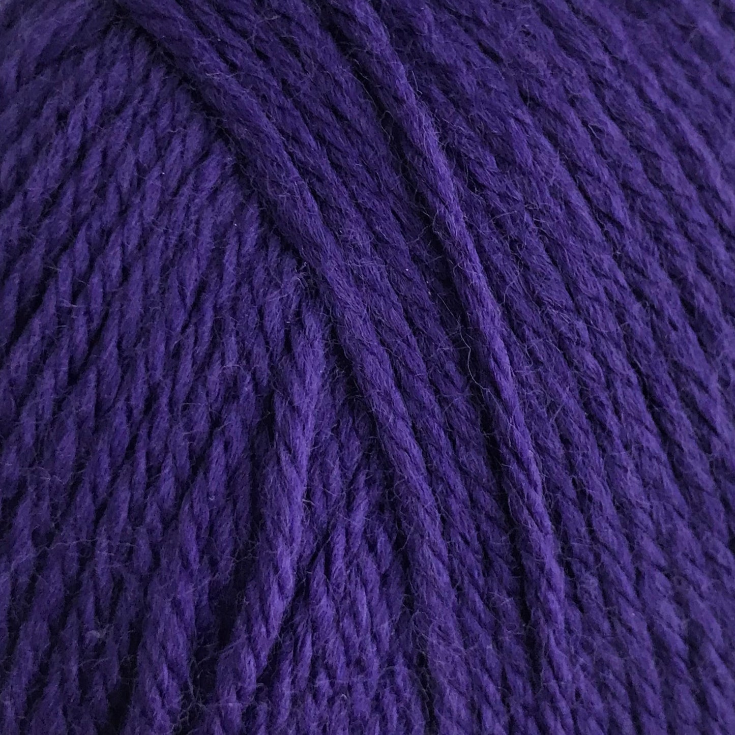 Purple yarn ball on a white background