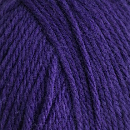 Purple yarn ball on a white background