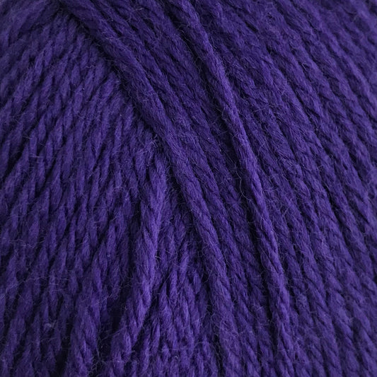 Purple yarn ball on a white background