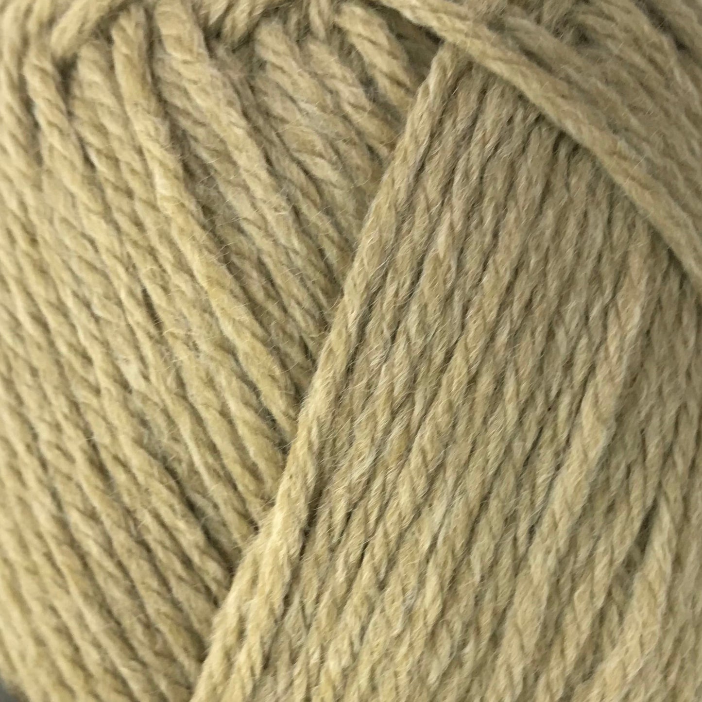 Ball of yarn with a black label on a white background