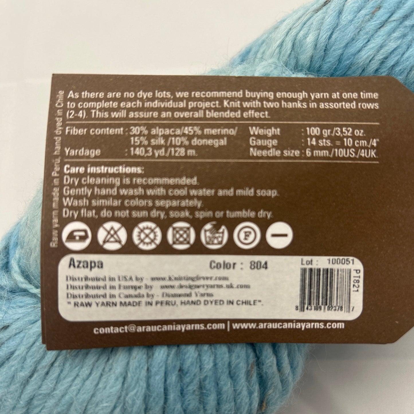 Light blue yarn with a label on a white background