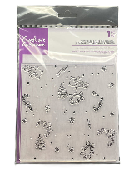 Packaged set of metal dies with Christmas-themed designs on a white background