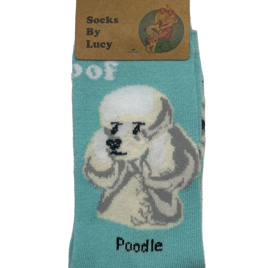 Teal sock with poodle design and label on a textured surface