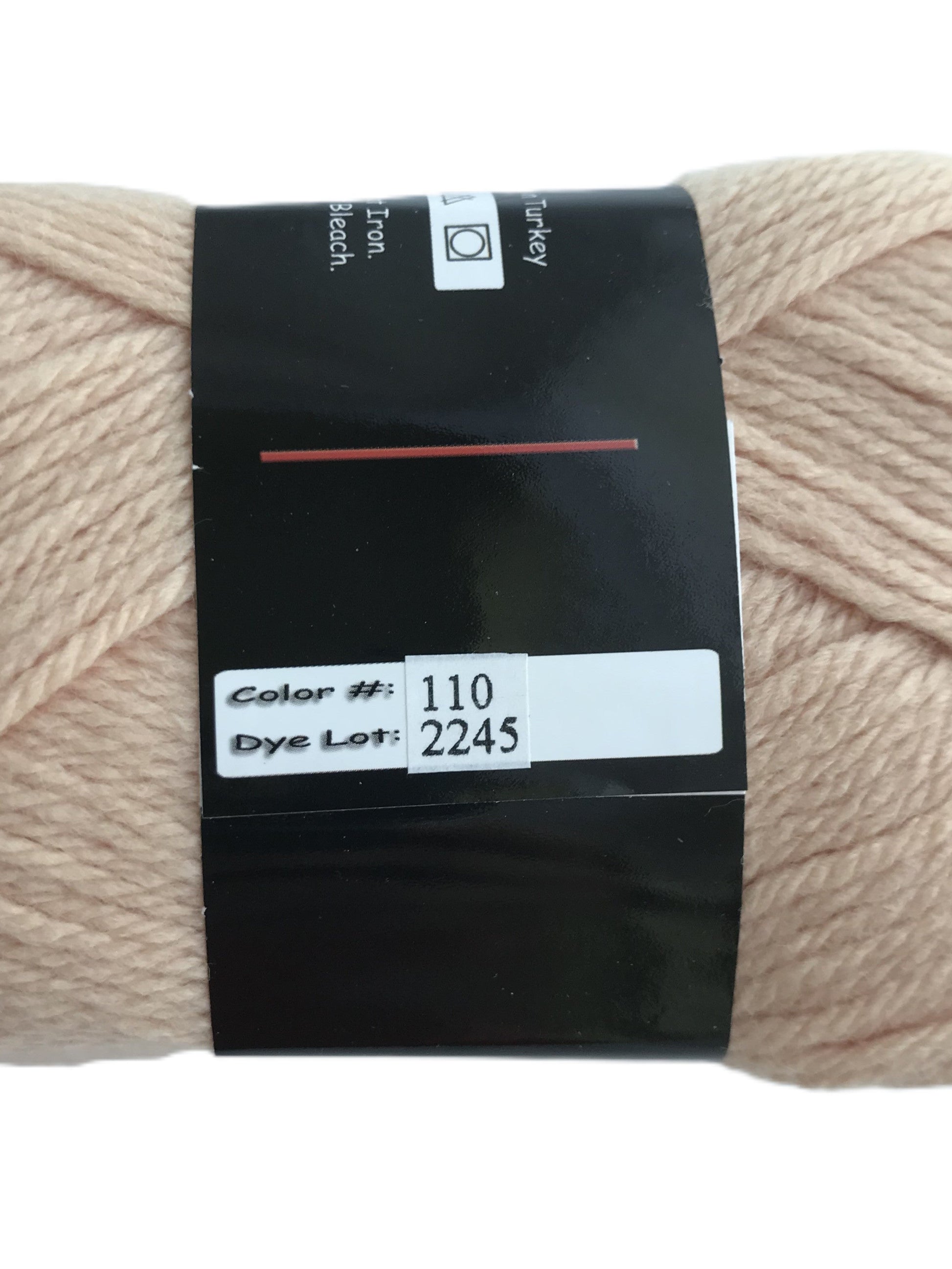 Beige skein of yarn with a label on a white background