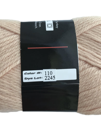 Beige skein of yarn with a label on a white background