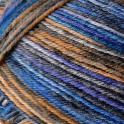 Close-up of multicolored yarn with blue, brown, and gray tones.