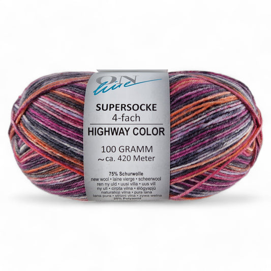 Multicolored skein of yarn with a label on a white background