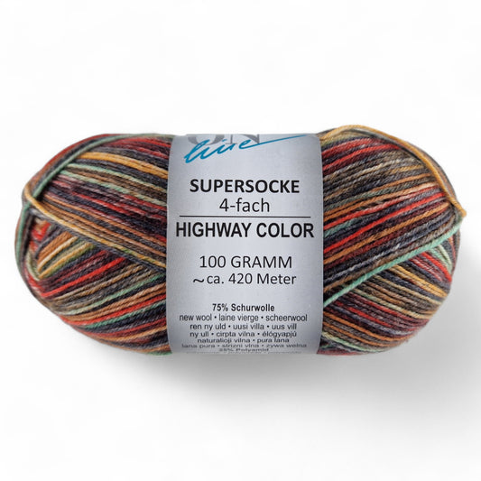 Multicolored skein of yarn with a label on a white background