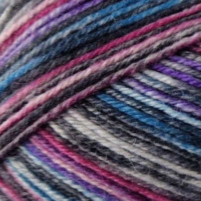 Close-up of multicolored yarn with purple, blue, and black tones.