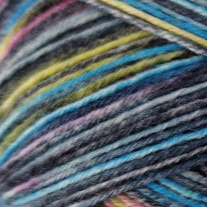 Close-up of multicolored yarn with blue, yellow, and purple hues.