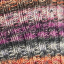 Close-up of striped fabric with multicolor pattern