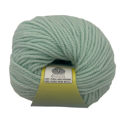 Light green skein of yarn with a label on a white background