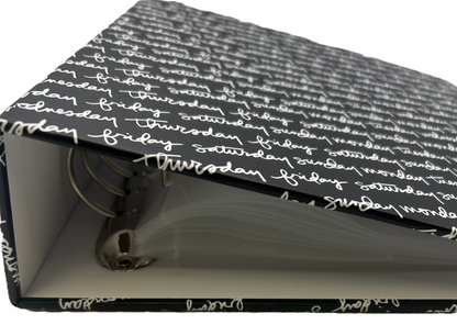 Black and white planner with text on a white background