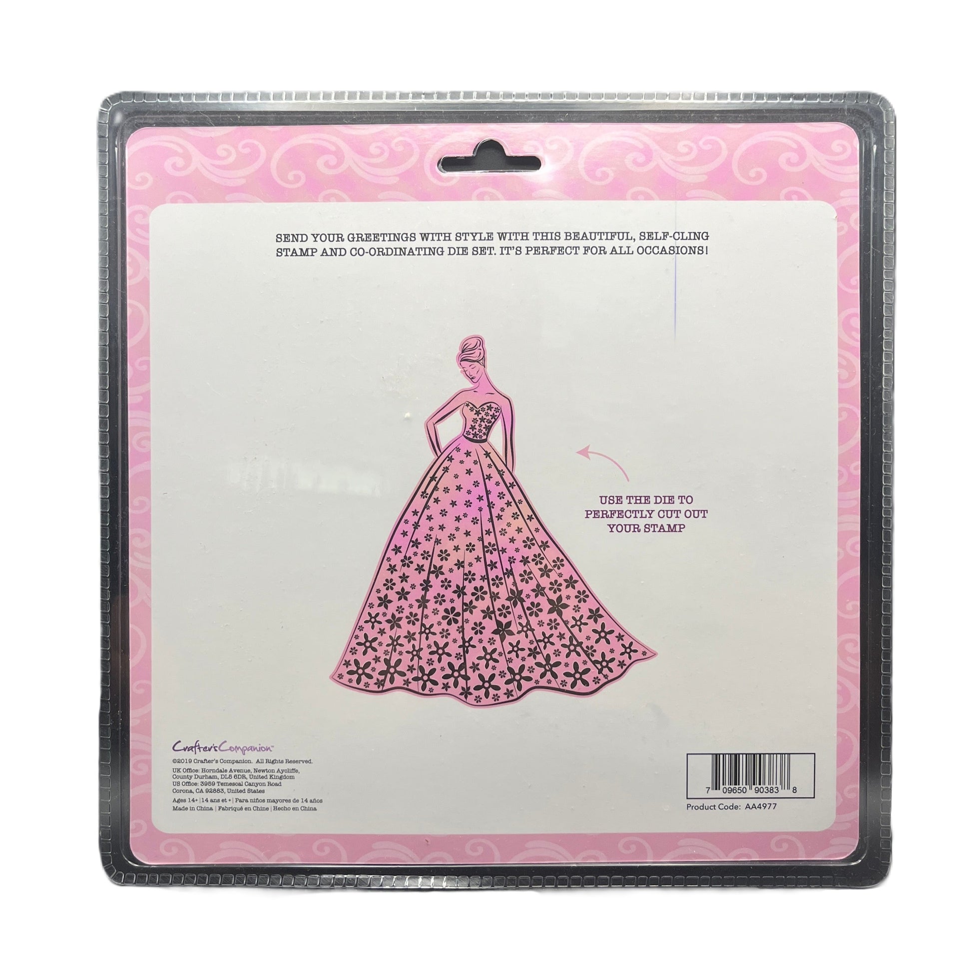 Package of a die set with a pink dress design on a white background