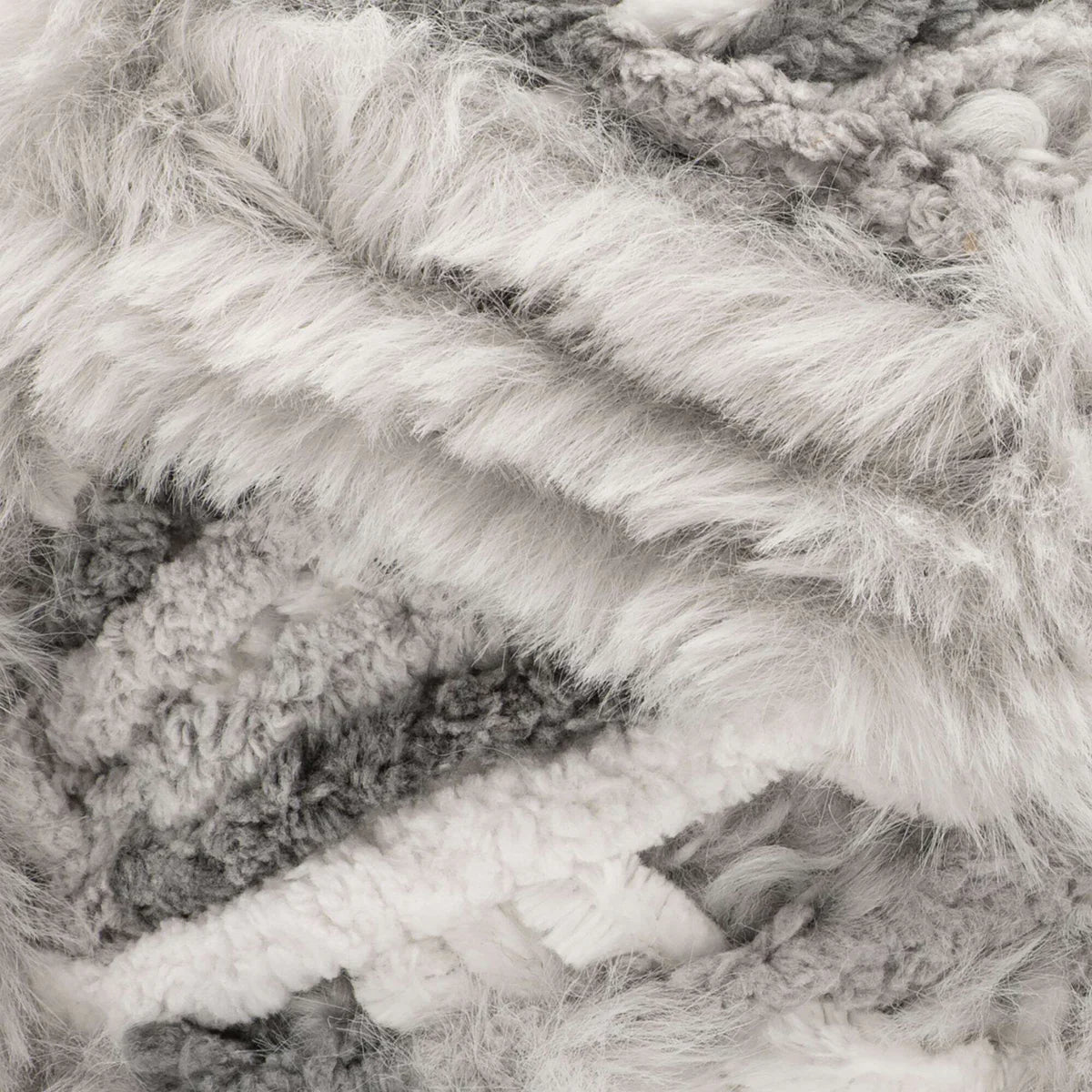 Close-up of textured yarn in gray and white tones