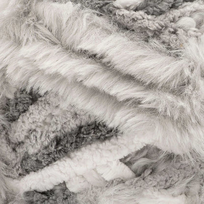 Close-up of textured yarn in gray and white tones