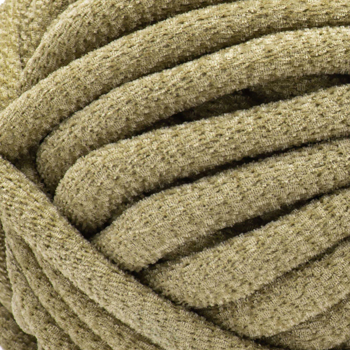 Close-up of a coiled beige fabric cable