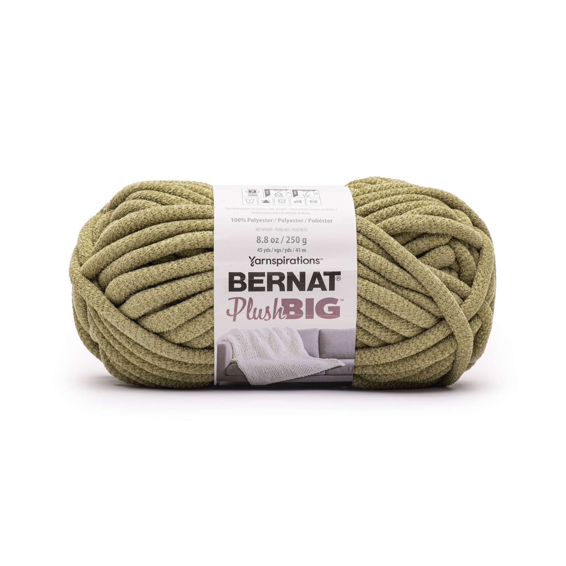 Ball of green yarn with Bernat Plush Big label on a white background