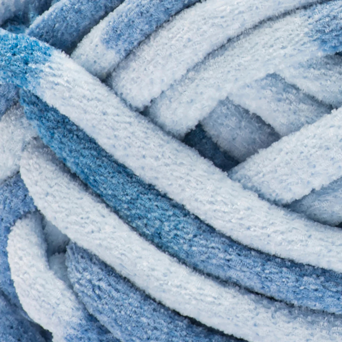 Close-up of blue and white textured yarn ball