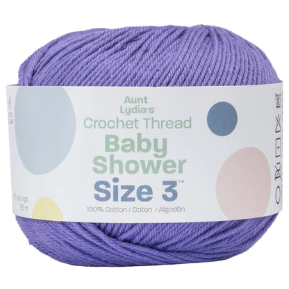 Ball of purple yarn with a label on a white background
